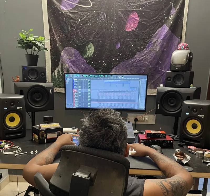 Ravi at his surround sound mixing desk with studio monitors