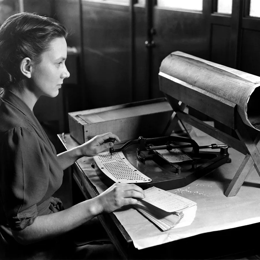 A card punch operator at her machine, around 1940